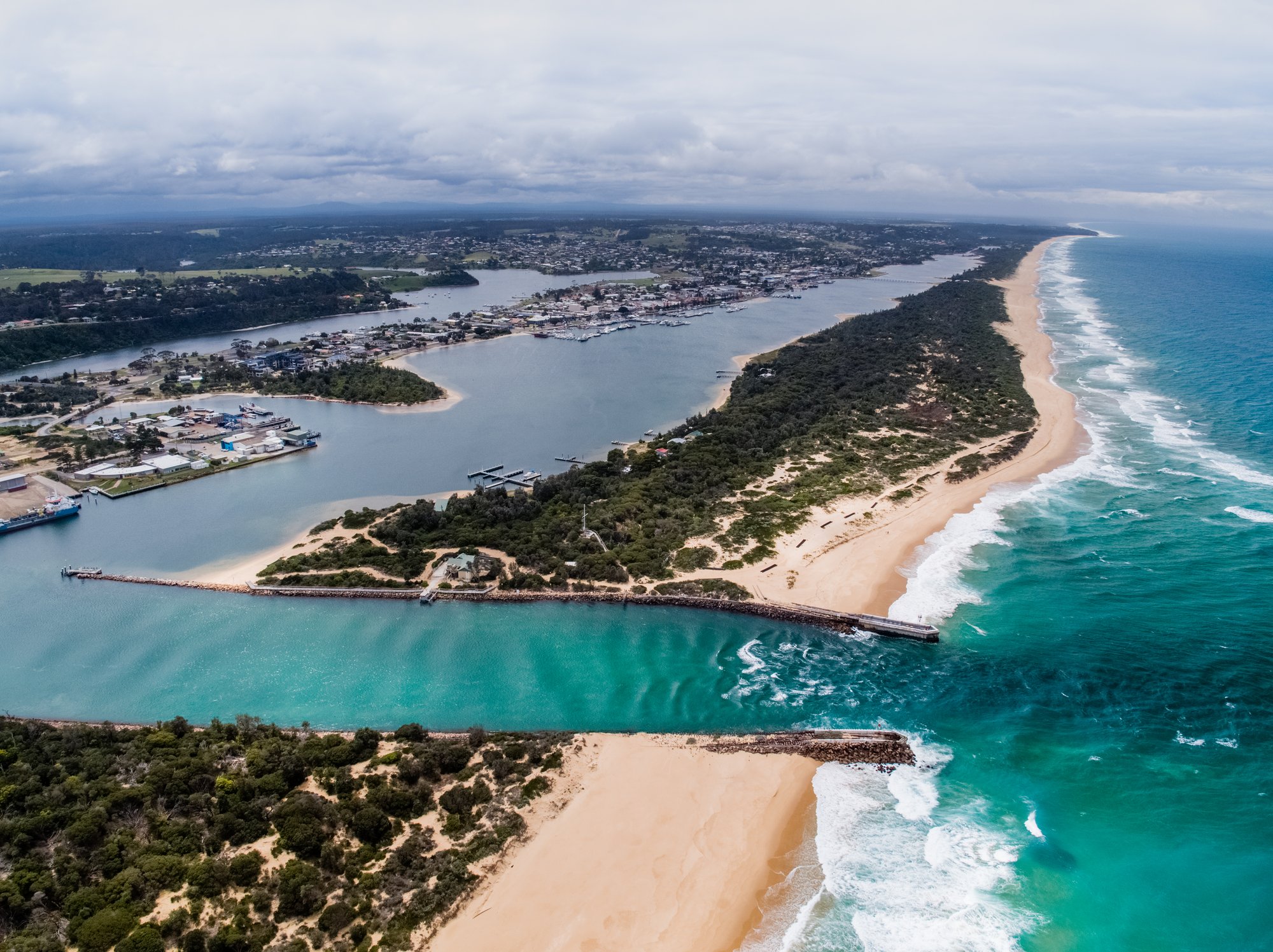 Aerial view of the Lakes Entrance channel meeting the ocean
